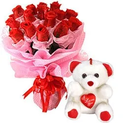 Cute Teddy Bear with a Cluster of Red Roses