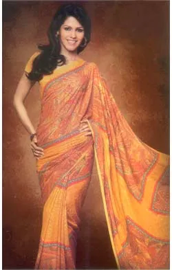 An Exclusive Georgette Saree in Beautiful Orange floral prints. The specially designed border gives a distinctive look.