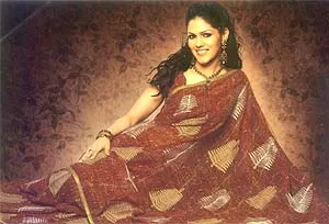 An exclusive georgette saree with brown and beige color combination completed with all over prints and light sequins work on the body and the border. The saree is eye-catching for the woman who cares for simplicity with a touch of elegance