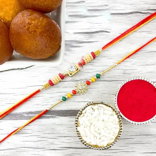 Gulp Gulabjamun with Traditional Rakhi Duo