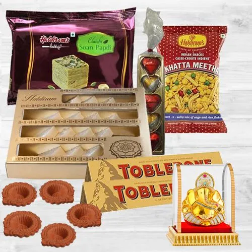 Tasty Haldirams Ambrosial Assortment with Diya n Lord Idol