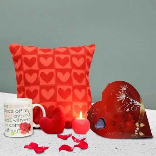Enticing Gift Combo of Cushion Heart Shape Chocolate n Ball Candle