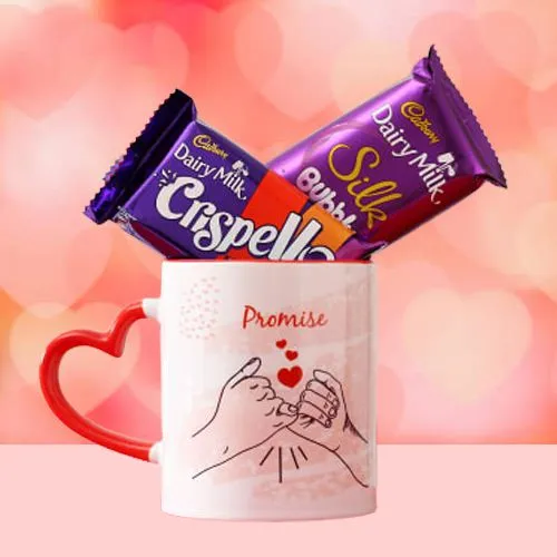 Yummy Cadbury Chocolate placed on Red Heart-Handle Mug