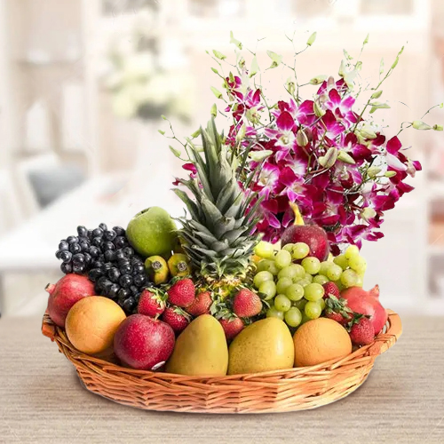 Delicious Fresh Fruits Basket with Fragrant Orchids Bouquet