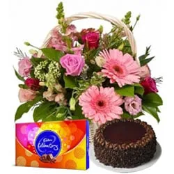 Deliver Chocolate Cake with Flowers in a Basket and Cadbury Celebrations 