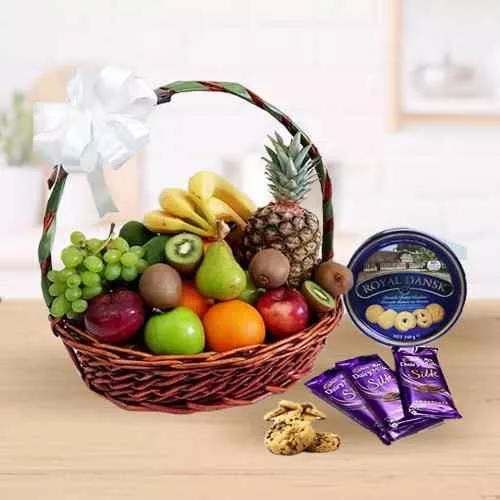 Delectable Fresh Fruits Basket with Danish Cookies N Chocolates