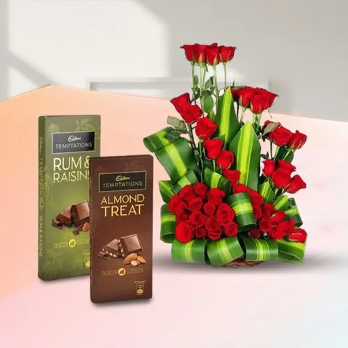 Fabulous Basket Arrangement of 50 Red Roses with Cadbury Temptation