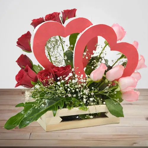 Breathtaking Basket Arrangement of Red N Pink Roses with Twin Heart Prop