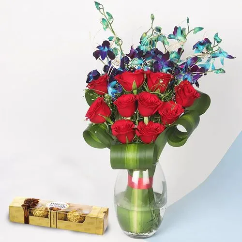 Impressive Red Roses n Blue Orchids in Vase with Ferrero Rocher Box