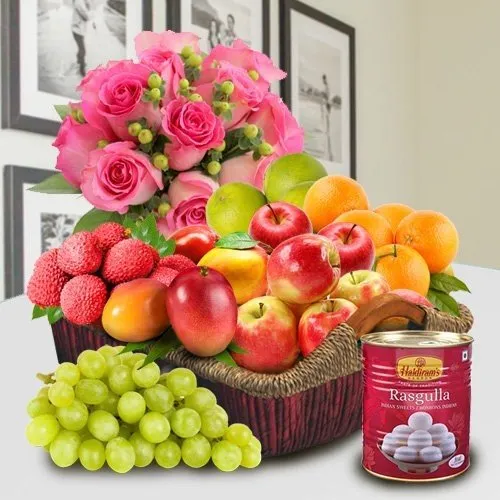 Shop Fresh Fruits in a Basket with Haldiram Rasgulla and Pink Rose Bouquet for Mom