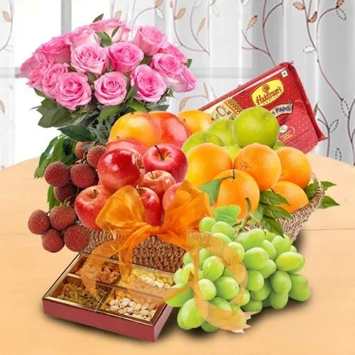 Mothers Day special basket of Fresh Fruits Sweets and Pink Roses