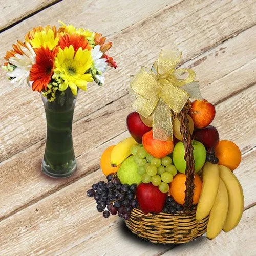 Exquisite Basket of Fresh Fruits with Colorful Gerberas in Vase
