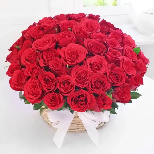 Deliver Red Roses Arranged in a Basket with Greens and Fillers for Mom