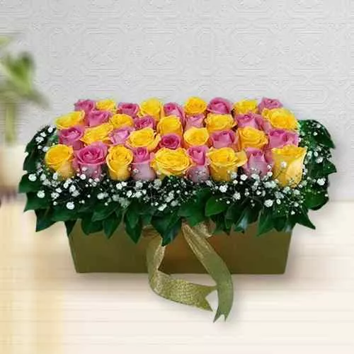 Vibrant Bed of Pink n Yellow Roses in Box