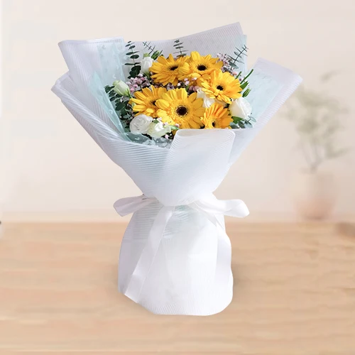 Charming Tissue Wrap Bouquet of White Roses n Yellow Gerberas