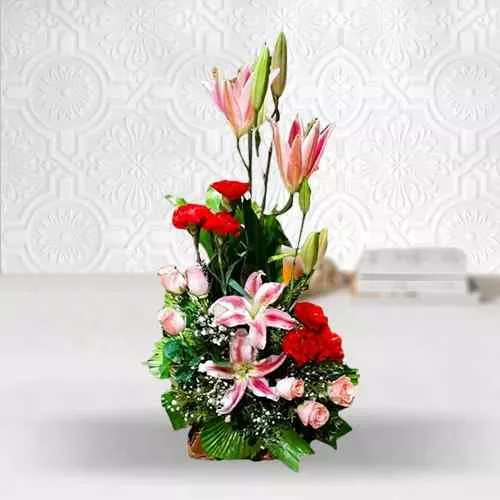 Elegant Arrangement of Pink Lilies with Red Carnations N Pink Roses