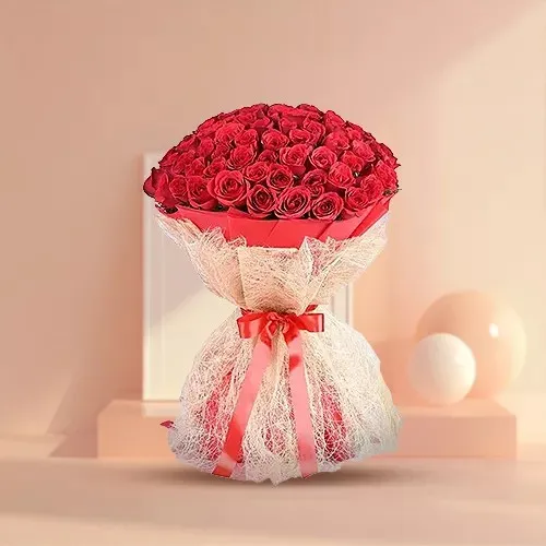 Send Red Roses Bouquet in Red Paper N White Jute Wrapping