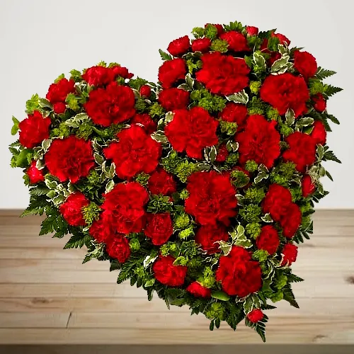 Scintillating 24 Red Carnations in Heart Shape
