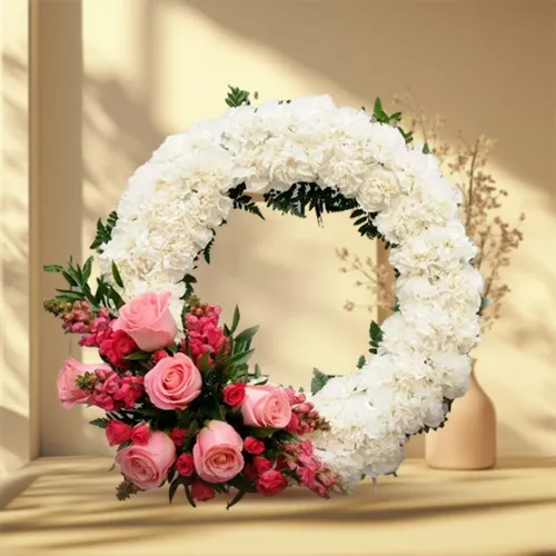 Sending Sympathy Wreath of Roses and Carnations 