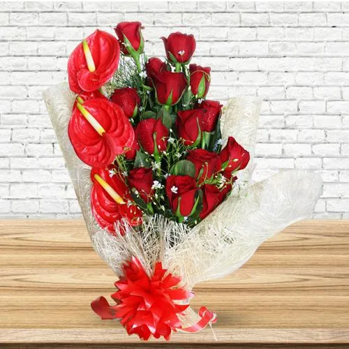 Shop for Bunch of Red Roses N Anthodium with Tissue Wrap