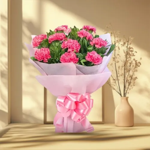 Send Ravishing Tissue Wrapped Hand Bouquet of Pink Carnations