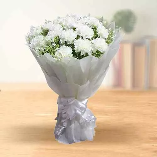 Shop for this elegant Hand Bouquet of Online White Cranations in a tissue wrap