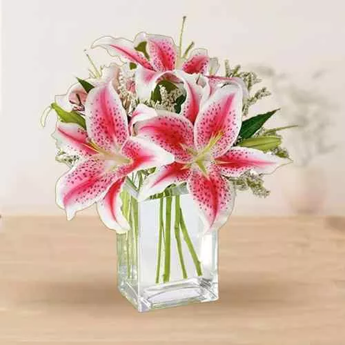 Pretty assemble of Pink Lilies in Glass Vase