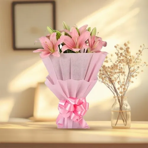 Order Beautiful Pink Lilies Bouquet wrapped in a Tissue