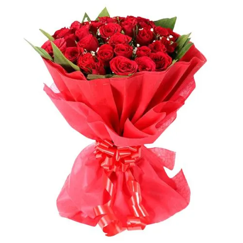 Flowering Selection of Red Color Roses artfully wrapped in Tissue