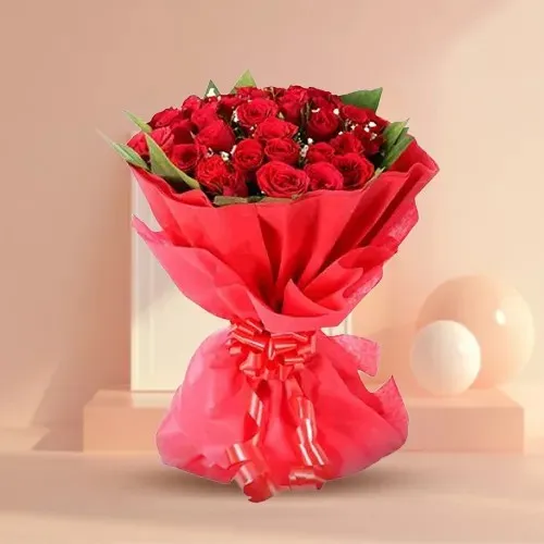 Sending Red Color Roses artfully wrapped in Tissue