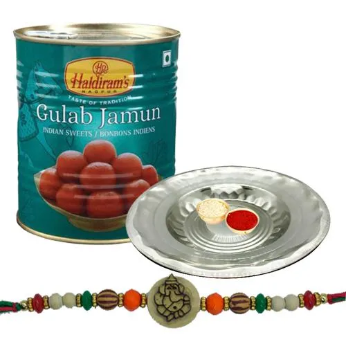 Appealing Ganesh Rakhi With Silver Puja Thali And Gulab Jamun
