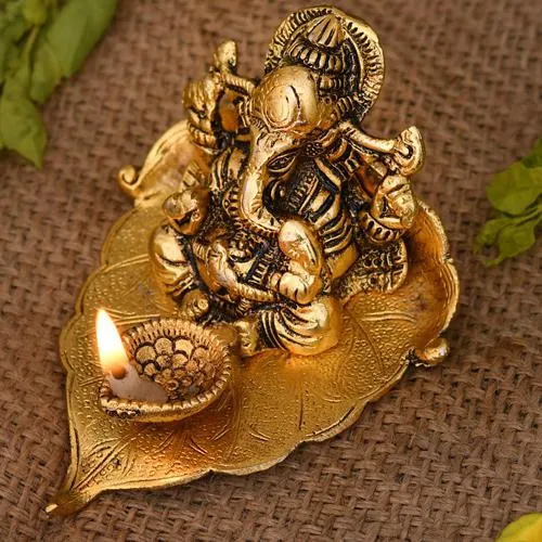 Exclusive Ganesha on Leaf with Diya