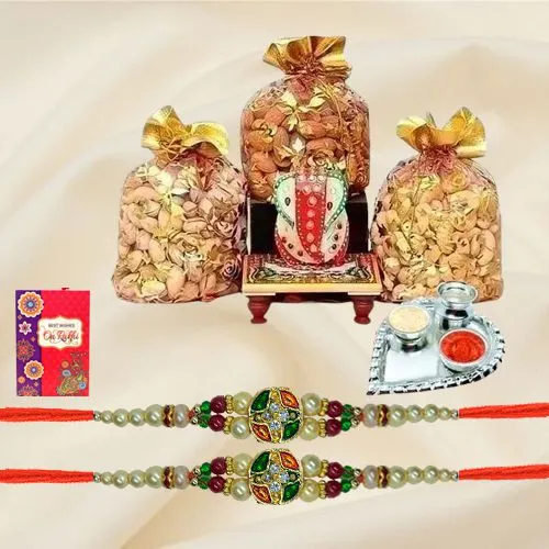 Appealing Stone Rakhis with Dry Fruits, Marble Ganesha n Paan Shaped Thali