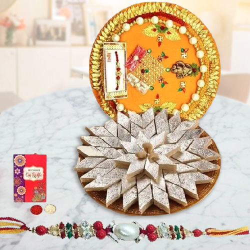 Delicious Kaju Katli and Designer Pooja Thali along Rakhi, Roli, Tilak and Chawal