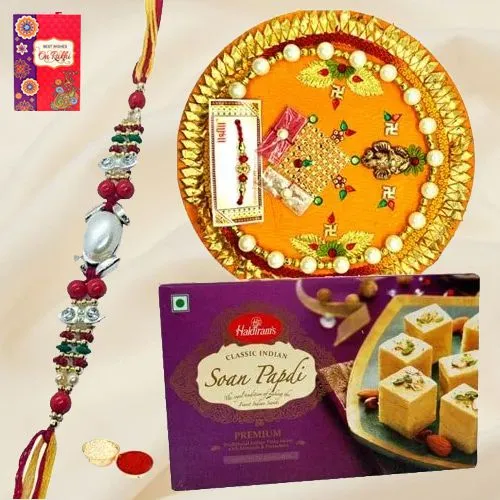 Soan Papri from Haldiram and Rakhi Thali along Rakhi Roli Tilak and Chawal