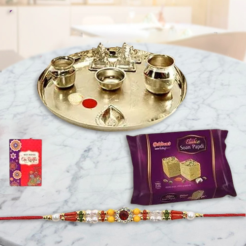 Soan Papri from Haldiram and Silver Plated Paan Shaped Puja Aarti Thali along with Rakhi