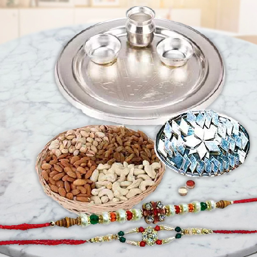 An amazing Silver plated Thali, <font color=#FF0000>Haldiram</font> Kaju Katli, Dry Fruits with free Rakhi, Roli Tilak and Chawal