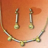 Send Beautiful 14K gold over sterling Silver necklace with a pair of earing decorated with solitaire crystal  stones.