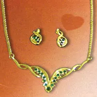 Beautiful set with silver plated gold base necklace and a pair of earing decorated with green coloured stones.